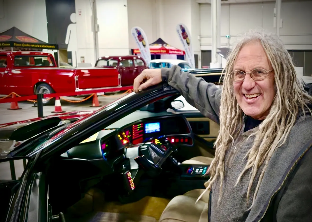 Mike Hall from Rust Valley Restaurations sitting inside the cockpit of the AGI KITT replica car at the Motorama Custom Car Show in Toronto